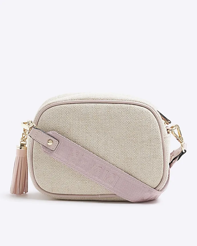 Beige canvas cross body camera bag