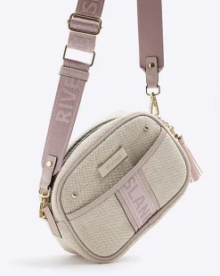 Beige canvas cross body camera bag