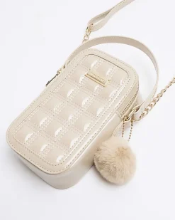 Beige quilted pom pom cross body bag