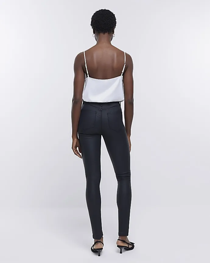 Black coated denim high waisted skinny jeans