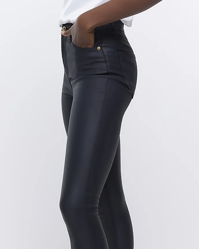 Black coated denim high waisted skinny jeans