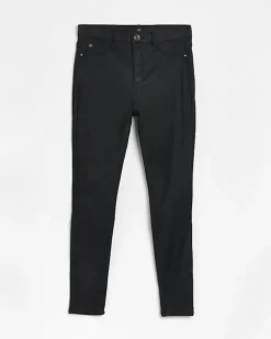 Black coated denim high waisted skinny jeans