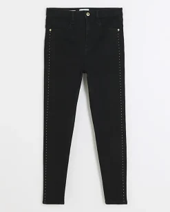 Black high waisted stud skinny jeans