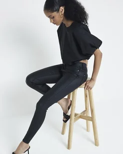 Black mid rise skinny coated jeans
