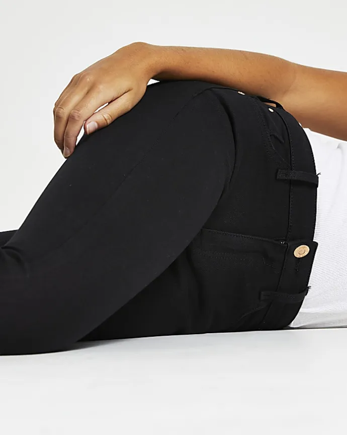 Black mid rise skinny jeans