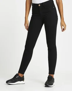 Black mid rise skinny jeans