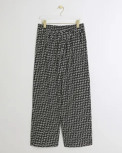 Black satin geometric wide leg trousers