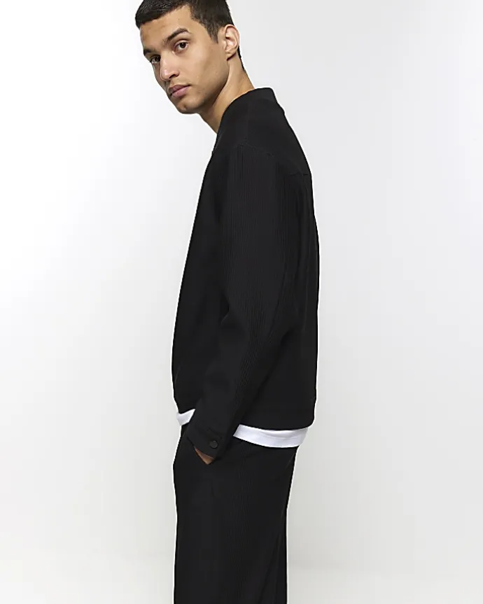 Black tapered fit plisse smart trousers
