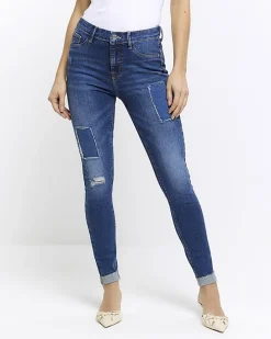 Blue mid rise bum sculpt patch skinny jeans