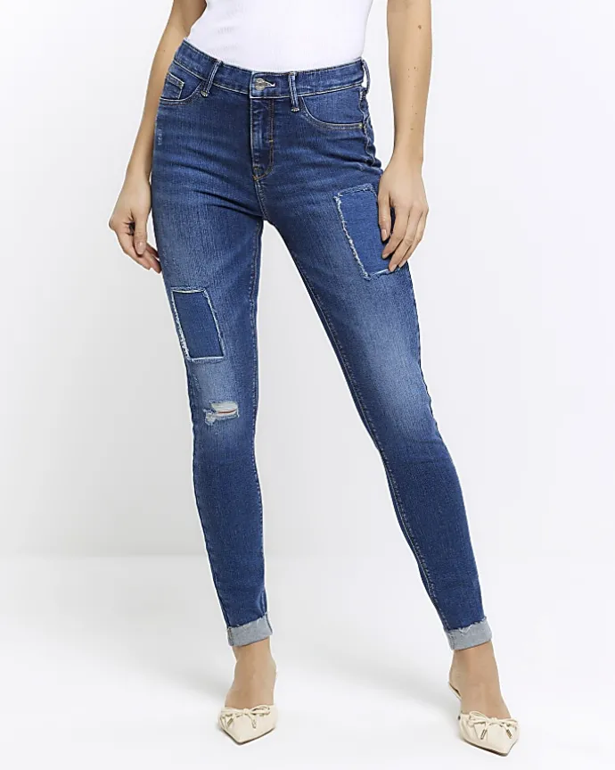 Blue mid rise bum sculpt patch skinny jeans