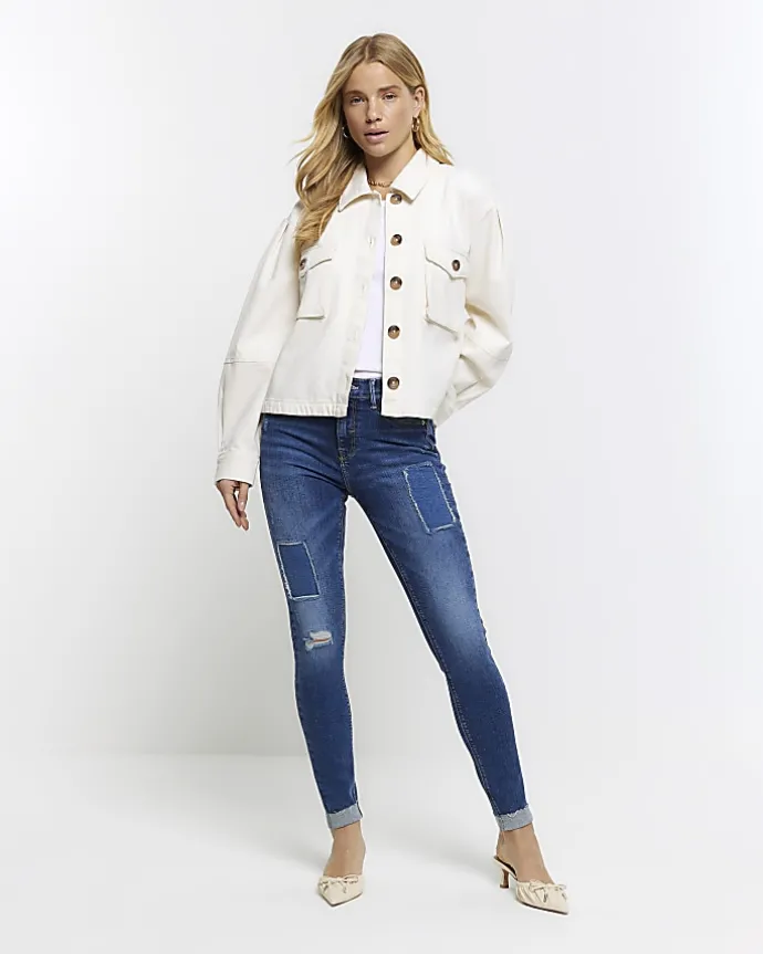 Blue mid rise bum sculpt patch skinny jeans
