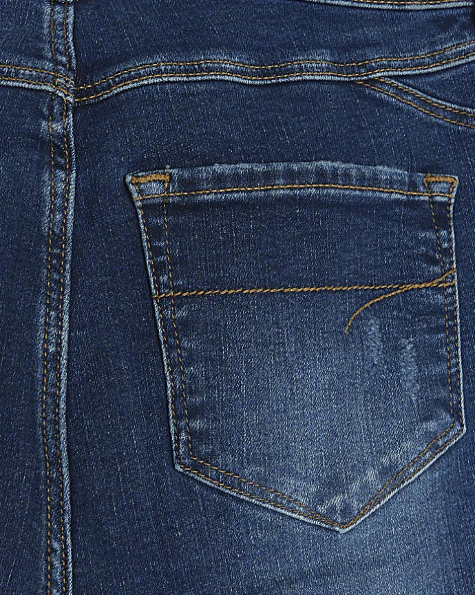 Blue mid rise bum sculpt patch skinny jeans