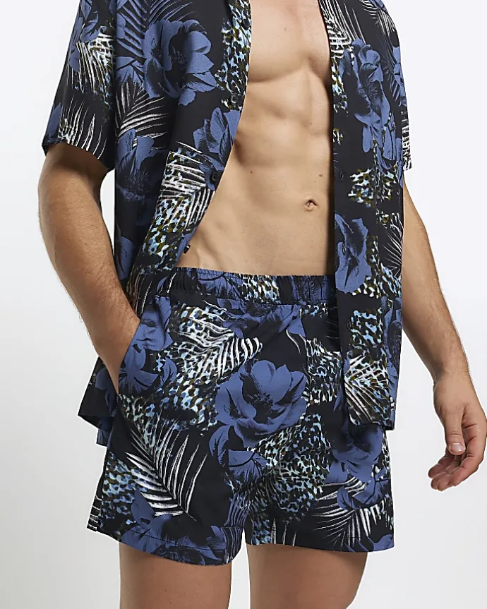 Blue regular fit botanical print shorts
