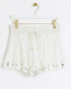 Cream metallic stripe beach shorts