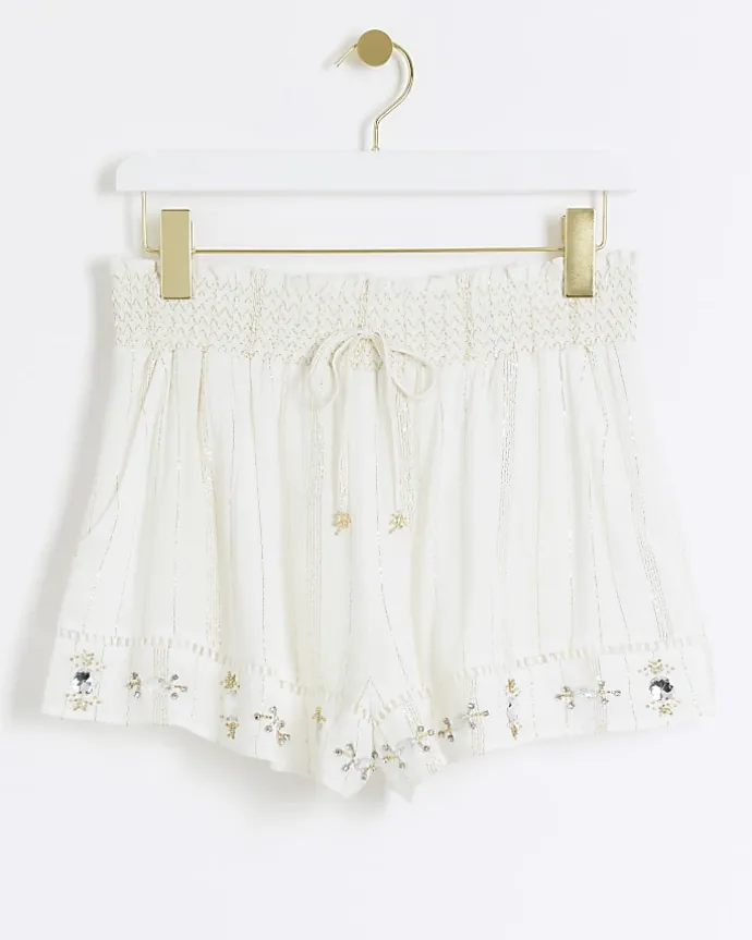 Cream metallic stripe beach shorts