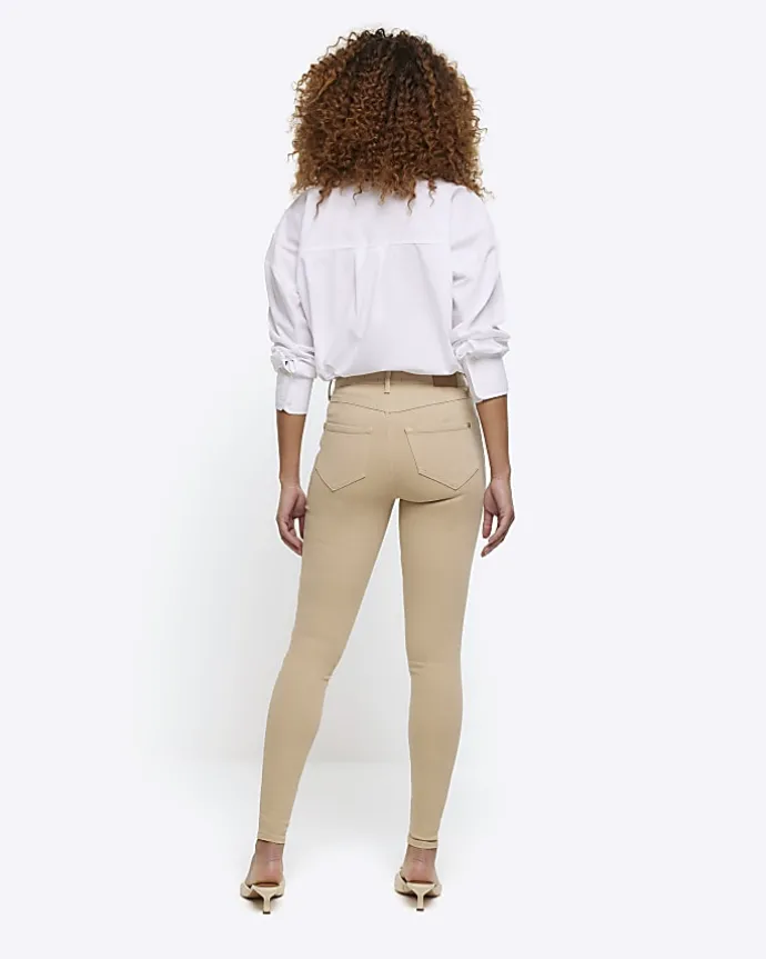 Cream mid rise bum sculpt jeggings