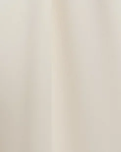 Cream pleated wide leg trousers