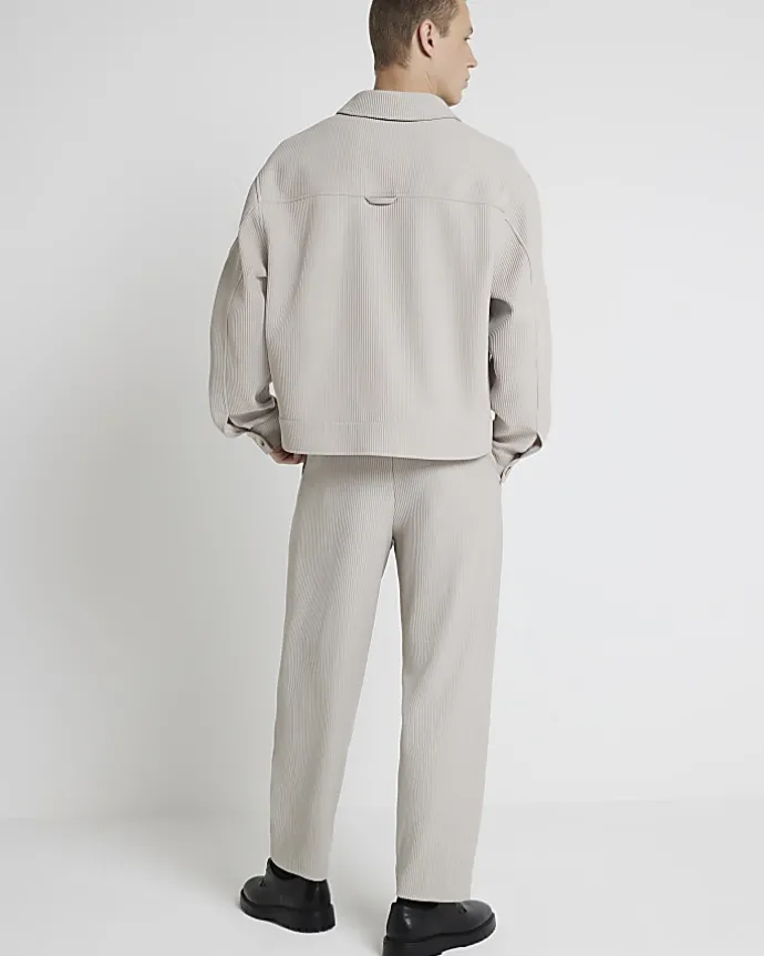 Ecru tapered fit plisse smart trousers