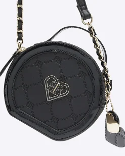 Girls black circle embossed cross body bag