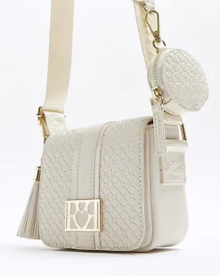 Girls cream embossed monogram cross body bag