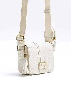 Girls cream embossed monogram cross body bag