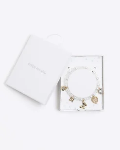 Girls cream pearl charm bracelet