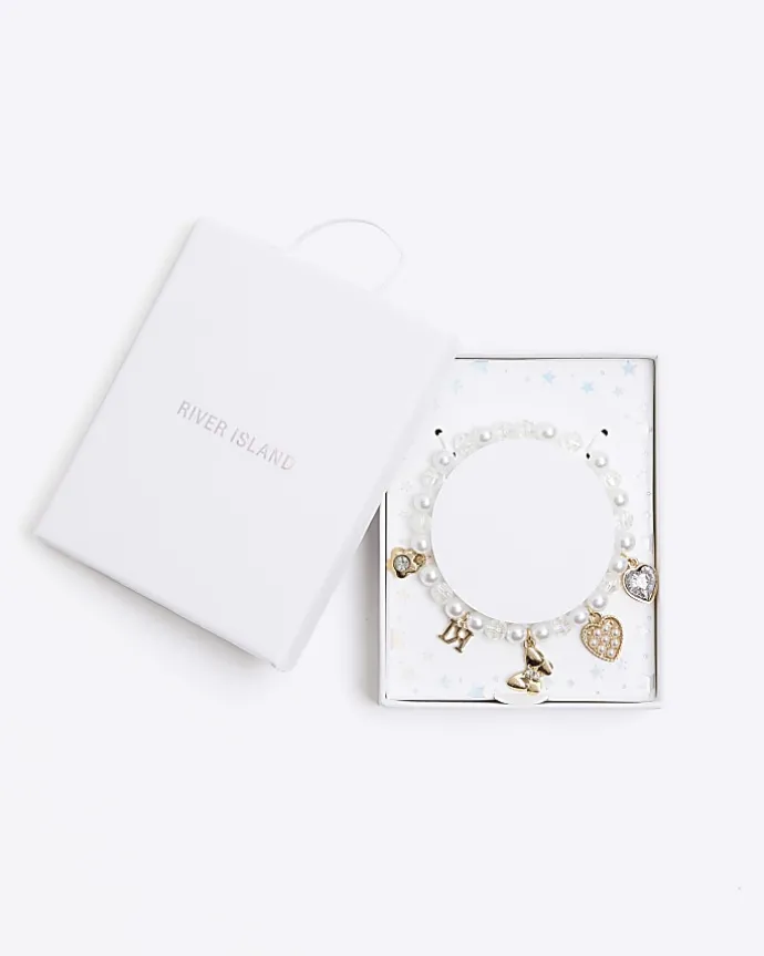 Girls cream pearl charm bracelet