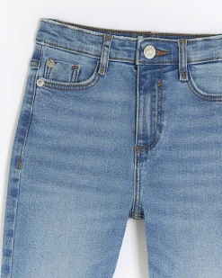 Girls denim let down hem skinny jeans