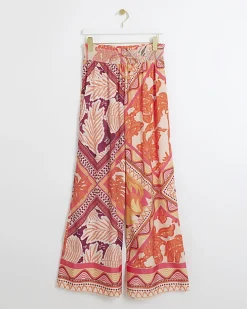 Orange floral wide leg trousers
