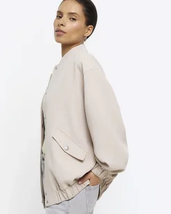 Petite beige oversized bomber jacket