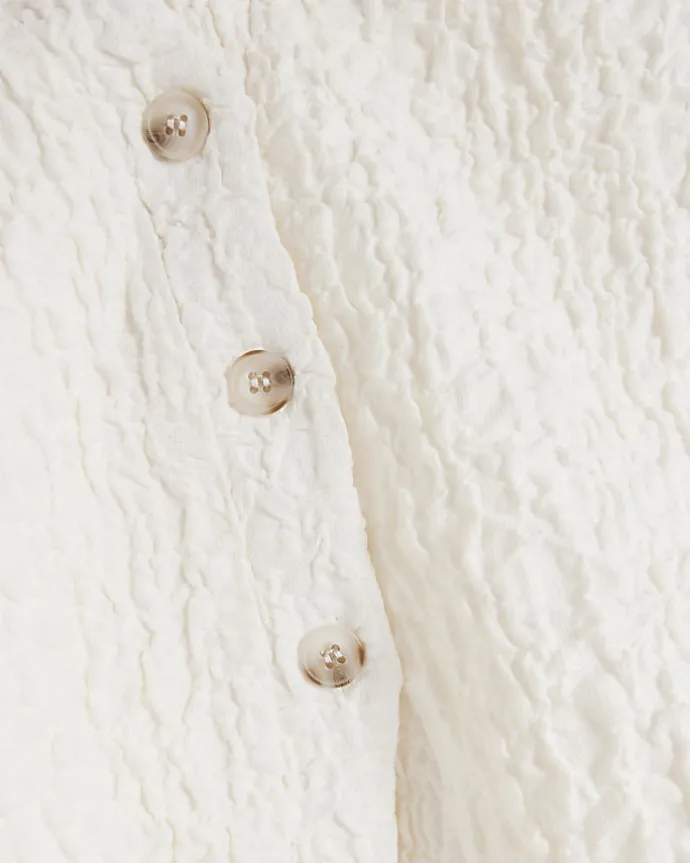Petite cream textured long sleeve shirt