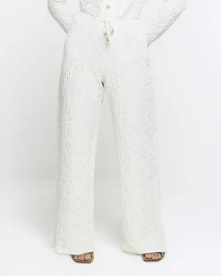 Petite cream textured wide leg trousers