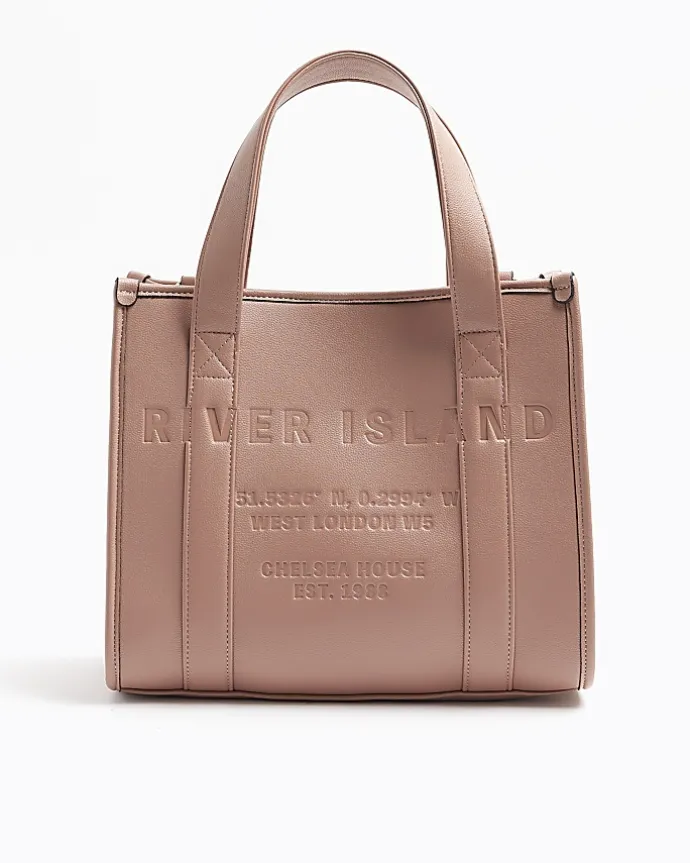 Pink embossed cross body tote bag