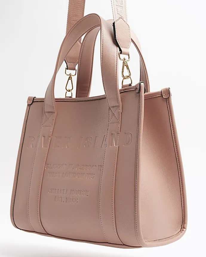 Pink embossed cross body tote bag