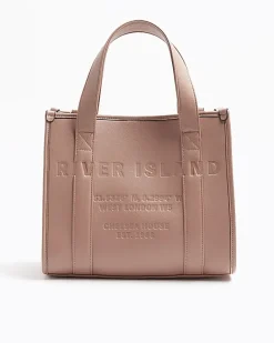 Pink embossed cross body tote bag