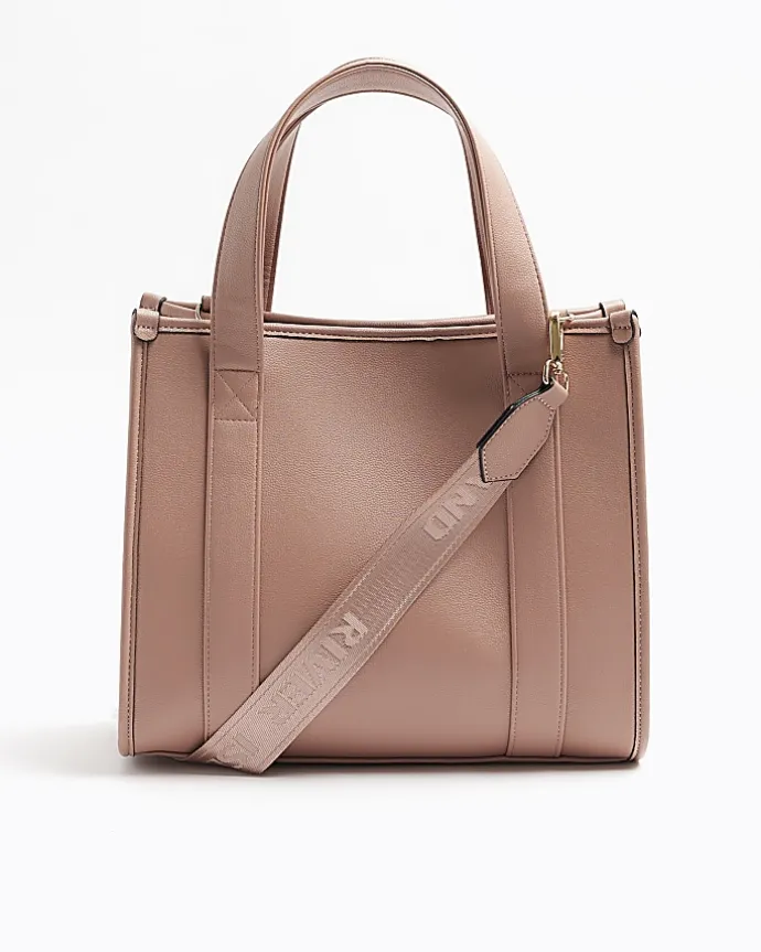 Pink embossed cross body tote bag