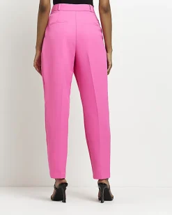 Pink pleated tapered trousers