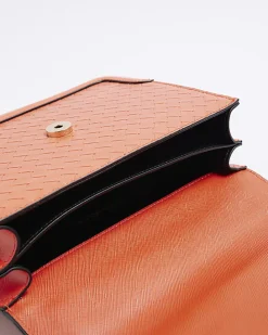 Red embossed woven satchel bag
