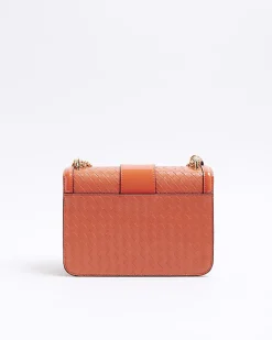 Red embossed woven satchel bag
