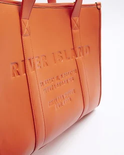 Red faux leather embossed shopper bag