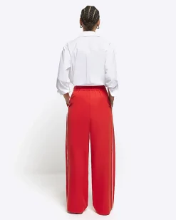 Red side stripe wide leg trousers