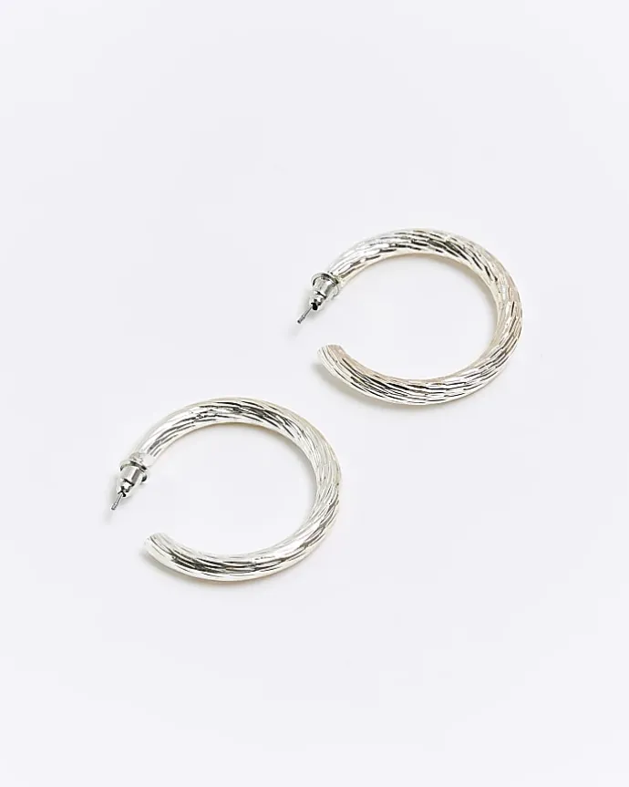 Silver textured hoop earrings