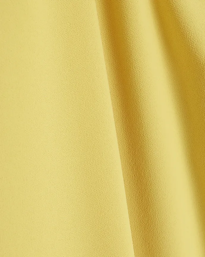 Yellow pleated wide leg trousers